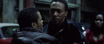 Movie still from “8 Mile” (2002), directed by Curtis Hanson – Two men standing next to each other on a street; Close Up shot, Over the shoulder angle