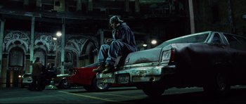Movie still from “8 Mile” (2002), directed by Curtis Hanson – A man sitting on the back of a truck; Wide shot, Low angle