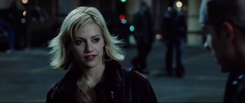 Movie still from “8 Mile” (2002), directed by Curtis Hanson – A woman with blonde hair is walking down the street; Close Up shot, Over the shoulder angle