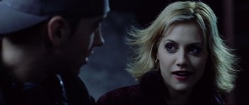 Movie still from “8 Mile” (2002), directed by Curtis Hanson – A woman with blonde hair and a black jacket is talking to a man; Close Up shot, Over the shoulder angle