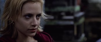 Movie still from “8 Mile” (2002), directed by Curtis Hanson – A woman with blonde hair and a red shirt; Close Up shot, Over the shoulder angle