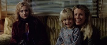 Movie still from “8 Mile” (2002), directed by Curtis Hanson – A woman and a child sitting on a couch; Close Up shot, Over the shoulder angle