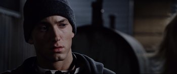 Movie still from “8 Mile” (2002), directed by Curtis Hanson – A person wearing a hat; Close Up shot, Low angle