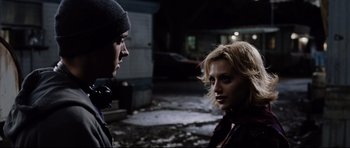 Movie still from “8 Mile” (2002), directed by Curtis Hanson – A man and a woman standing next to each other in the dark; Close Up shot, Over the shoulder angle