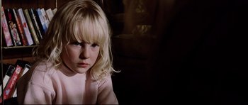 Movie still from “8 Mile” (2002), directed by Curtis Hanson – A little girl with blonde hair sitting in a room; Close Up shot, Over the shoulder angle