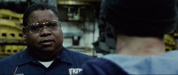 Movie still from “8 Mile” (2002), directed by Curtis Hanson – A man wearing safety glasses talking to another man; Close Up shot, Low angle