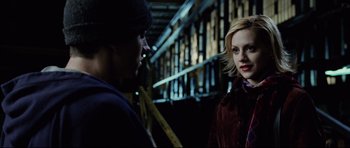 Movie still from “8 Mile” (2002), directed by Curtis Hanson – A man and a woman are standing next to each other; Medium shot, Over the shoulder angle