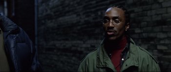 Movie still from “8 Mile” (2002), directed by Curtis Hanson – A man in a green jacket standing in front of a brick wall; Close Up shot, Low angle