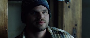 Movie still from “8 Mile” (2002), directed by Curtis Hanson – A person wearing a hat; Close Up shot, Over the shoulder angle