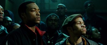 Movie still from “8 Mile” (2002), directed by Curtis Hanson – A group of men standing next to each other in a room; Close Up shot, Low angle