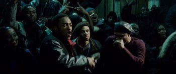 Movie still from “8 Mile” (2002), directed by Curtis Hanson – A group of young men standing next to each other; Medium shot, Over the shoulder angle