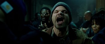 Movie still from “8 Mile” (2002), directed by Curtis Hanson – A man with his mouth wide open and his eyes wide open; Close Up shot, Low angle
