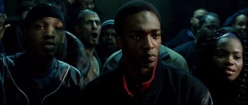 Movie still from “8 Mile” (2002), directed by Curtis Hanson – A group of men standing around a building; Close Up shot, Over the shoulder angle