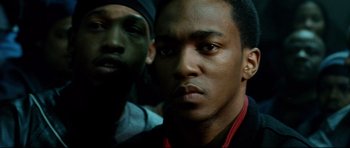 Movie still from “8 Mile” (2002), directed by Curtis Hanson – Two people with one of them looking at the camera; Close Up shot, Over the shoulder angle