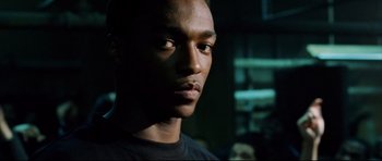 Movie still from “8 Mile” (2002), directed by Curtis Hanson – A person wearing a black t - shirt; Close Up shot, Low angle