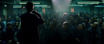 Movie still from “8 Mile” (2002), directed by Curtis Hanson – A crowd of people are gathered in a dark room; Wide shot, High angle