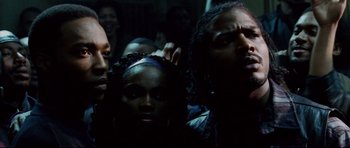 Movie still from “8 Mile” (2002), directed by Curtis Hanson – A group of people standing next to each other in the dark; Close Up shot, Low angle