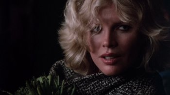 Movie still from “9½ Weeks” (1986), directed by Adrian Lyne – A person with blonde hair; Close Up shot, Low angle