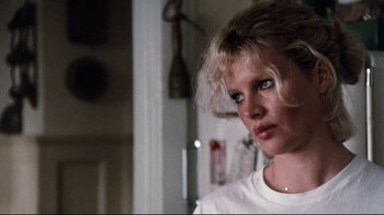 Movie still from “9½ Weeks” (1986), directed by Adrian Lyne – A person wearing a white t - shirt; Close Up shot, Low angle