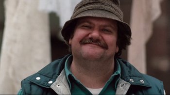 Movie still from “9½ Weeks” (1986), directed by Adrian Lyne – A person wearing a hat; Close Up shot, Low angle
