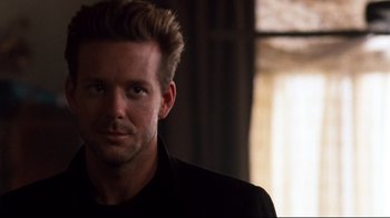 Movie still from “9½ Weeks” (1986), directed by Adrian Lyne – A person wearing a suit and tie; Close Up shot, Over the shoulder angle