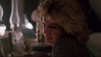 Movie still from “9½ Weeks” (1986), directed by Adrian Lyne – A person with blonde hair; Close Up shot, Low angle