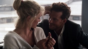 Movie still from “9½ Weeks” (1986), directed by Adrian Lyne – A man and a woman are holding hands and looking at one another; Close Up shot, Over the shoulder angle