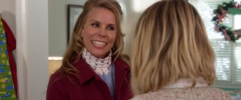 Movie still from “A Bad Moms Christmas” (2017), directed by Scott Moore – A woman in a red jacket smiling at a woman in a red jacket; Close Up shot, Over the shoulder angle