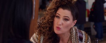 Movie still from “A Bad Moms Christmas” (2017), directed by Scott Moore – A person with curly hair; Close Up shot, Over the shoulder angle