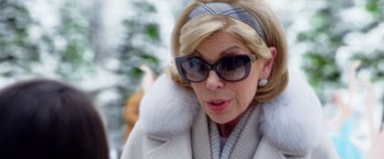 Movie still from “A Bad Moms Christmas” (2017), directed by Scott Moore – A person wearing sunglasses and a coat; Close Up shot, Over the shoulder angle