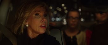 Movie still from “A Bad Moms Christmas” (2017), directed by Scott Moore – A woman sitting in a car with another woman in the background; Close Up shot, Over the shoulder angle