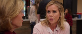 Movie still from “A Bad Moms Christmas” (2017), directed by Scott Moore – A person wearing a pink jacket; Close Up shot, Over the shoulder angle