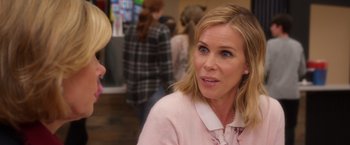 Movie still from “A Bad Moms Christmas” (2017), directed by Scott Moore – A person wearing a pink shirt; Close Up shot, Over the shoulder angle