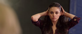 Movie still from “A Bad Moms Christmas” (2017), directed by Scott Moore – A beautiful young woman posing for a picture; Close Up shot, High angle