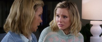 Movie still from “A Bad Moms Christmas” (2017), directed by Scott Moore – Two women talking to each other in front of a wall; Close Up shot, Over the shoulder angle