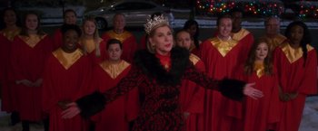 Movie still from “A Bad Moms Christmas” (2017), directed by Scott Moore – A group of people standing next to each other wearing costumes; Medium shot, Over the shoulder angle