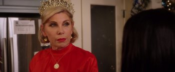 Movie still from “A Bad Moms Christmas” (2017), directed by Scott Moore – A woman wearing a tiara and a red dress; Close Up shot, Over the shoulder angle