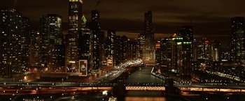 Movie still from “A Bad Moms Christmas” (2017), directed by Scott Moore – A view of a city at night from a bridge; Extreme Wide shot, High angle
