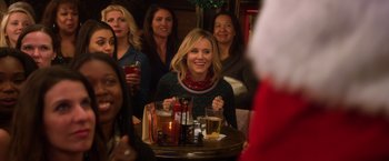 Movie still from “A Bad Moms Christmas” (2017), directed by Scott Moore – A group of people sitting at a table with drinks; Medium shot, Over the shoulder angle