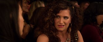 Movie still from “A Bad Moms Christmas” (2017), directed by Scott Moore – A person with curly hair; Close Up shot, Over the shoulder angle