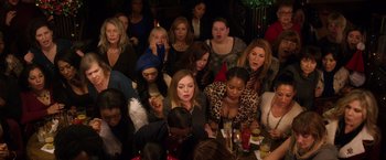 Movie still from “A Bad Moms Christmas” (2017), directed by Scott Moore – A group of women sitting at a table with drinks; Medium shot, High angle