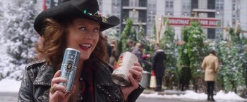 Movie still from “A Bad Moms Christmas” (2017), directed by Scott Moore – A woman in a cowboy hat holding a can of beer; Close Up shot, Low angle
