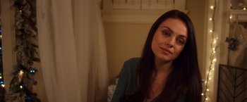 Movie still from “A Bad Moms Christmas” (2017), directed by Scott Moore – A beautiful young lady sitting in front of a window; Close Up shot, Over the shoulder angle