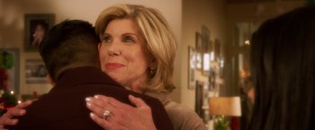 Movie still from “A Bad Moms Christmas” (2017), directed by Scott Moore – A person hugging a person in a living room; Close Up shot, Over the shoulder angle