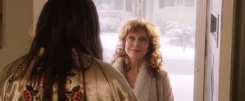 Movie still from “A Bad Moms Christmas” (2017), directed by Scott Moore – A woman standing next to another woman in front of a window; Close Up shot, Over the shoulder angle