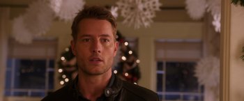 Movie still from “A Bad Moms Christmas” (2017), directed by Scott Moore – A person wearing a jacket in a room; Close Up shot, Over the shoulder angle