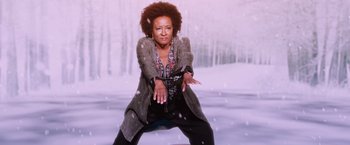 Movie still from “A Bad Moms Christmas” (2017), directed by Scott Moore – An image of an african american woman posing for a picture; Medium shot, High angle