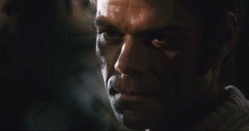 Movie still from “A Bay of Blood” (1971), directed by Mario Bava – A man's face in the dark; Close Up shot, Low angle