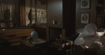 Movie still from “A Bay of Blood” (1971), directed by Mario Bava – A living room with a fireplace and a television set; Wide shot, High angle