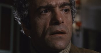 Movie still from “A Bay of Blood” (1971), directed by Mario Bava – A person wearing a sweater; Close Up shot, Low angle